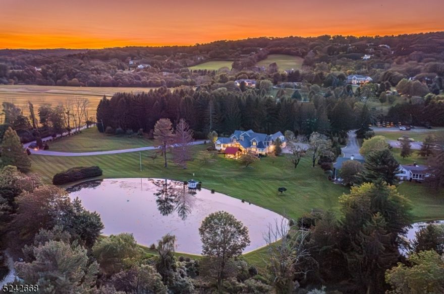 One of a kind gem nestled on a magical 18 farm assessed acres in the heart of the Roxiticus Valley. Prestigious builder's own residence built to perfection in 2020. No expense was spared in the construction of this exquisite home designed by renown architect Jeffrey Beer.  Two spectacular stocked spring fed ponds grace the property replete with specimen plantings and fruit trees. Step inside the stone and granite front entry to find soaring ceilings, architectural moldings, curved corners and natural solid oak wood flooring. The spectacular kitchen, adjoining breakfast room and butlers pantry is complimented by all custom cabinetry, quartz counters, 48 inch Thermador 6 burner range and two Thermador refrigerators and standing freezer.  Gorgeous 1st floor master suite boasts 2 luxurious master baths and 2 enormous walk in closets. 2 large offices on this floor can also be converted into bedrooms. Upstairs you'll find 3 additional bedrooms with ensuite baths and a large bonus room with access to the grounds. The enormous lower level is fully finished with 12 foot ceilings, family room, media room, game room, a full kitchen with 2 dining areas and a half bath. The property has multiple outbuildings including a 2bd cottage and gentlemen's barn with pumpkin pine wide plank floors, full bar,WB stove and 1/2 bath. The magnificent outdoor entertainig space dazzles with granite terraces, pergola w/ recessed lighting, gazebos, tennis/pickle courts and outdoor gas fireplace. Perfection!