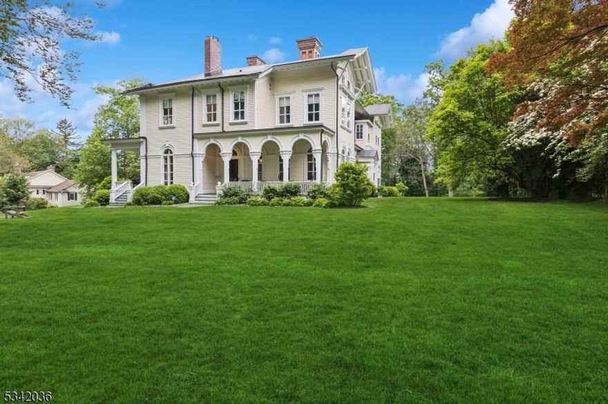 The Holt Mansion, built in 1855 by William Kitchell, a professor at Newark Institute, is a stunning historic home with a rich past. The house boasts a grand foyer, 10 fireplaces, beautiful hardwood floors, and extensive detailing throughout. With high ceilings, built-ins, and arched doorways, the home exudes elegance and charm. The 6-bedroom, 5.2-bathroom residence sits on 2.09 landscaped acres with a 3-car detached garage. The renovated gourmet kitchen features top-of-the-line appliances such as Viking, SubZero, and Miele, along with a center island and eat-in area. 3 covered porches at the back, front and side of the house are perfect for entertaining or enjoying a peaceful moment outdoors. The primary bedroom includes his and her walk-in closets, a sitting area, and a luxurious bath. All bathrooms in the home have been updated, and the property has been meticulously maintained over the years. Located near Morristown and Madison, this home offers a perfect blend of historic charm and modern amenities, with a rich history including a rental by Teddy Roosevelt.