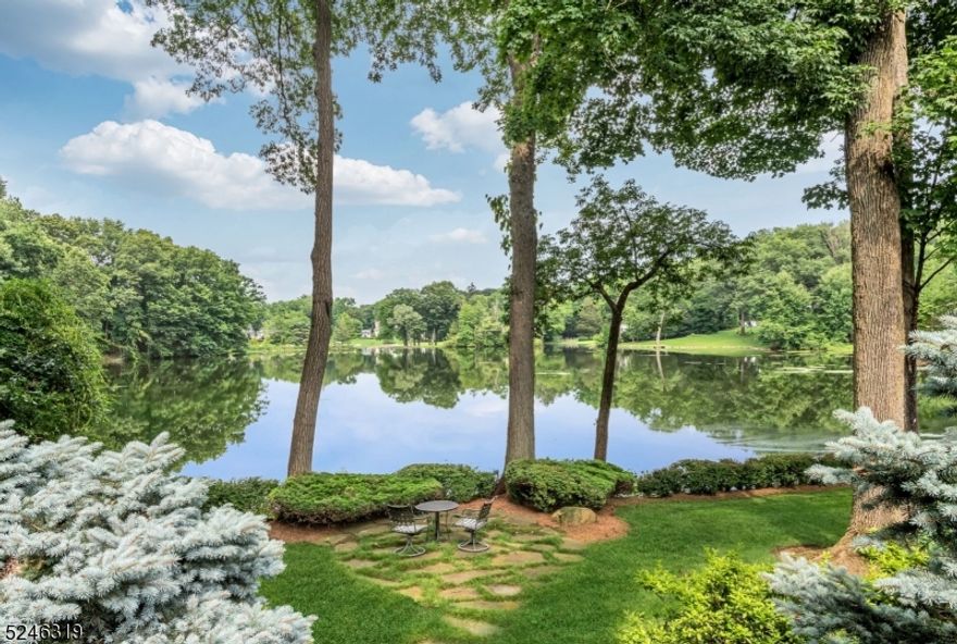 Discover your new life at the water's edge - where every day is a journey into serenity and natural beauty. Only 16 houses surround this pristine lake where you can enjoy total privacy and breathtaking views that come with every season. Jump in a canoe or kayak from your dock, cast a fishing line, or sit under a shade tree and watch the swans and herons. Rebuilt and expanded by current owners, enjoy approx. 6000 sf of well planned customized detail that was designed to optimize the lake experience. Enjoy views through walls of windows in the 2-story great room that is open to the chef's kitchen, sun room and screened porch. Formal living room and dining room have French doors to the covered porch. All bedrooms are spacious and private, especially the owners suite with luxe spa bath, walk-in-closet, and, yes, more lake views! The work-from-home office also works as a 5th bedroom! The grade level family/media room boasts a wine room and custom wet bar. As a Shadow Lakes Club member, enjoy access to the pool, tennis, boating and new friends!