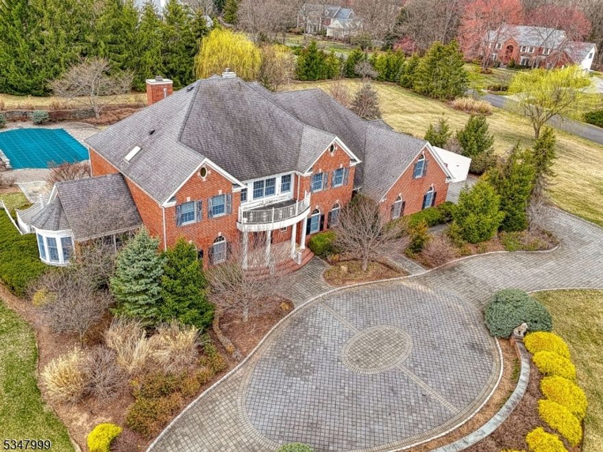 Welcome to 58 High Meadow Lane an exceptional estate in the 29-home Beacon Manor enclave in The Hills of Basking Ridge. Situated on a beautifully landscaped private 2.73-acre lot, this north-facing brick home features a heated inground pool with spa and waterfall, paved double wide driveway, and resort-like outdoor living with pergola, 3 tiered fountain, gazebo and pool house storage. Inside, enjoy a dramatic diva staircase grand foyer with 2-story family room with beamed ceilings and fireplace, a sun drenched conservatory, custom richly shelved wood library, first-floor bedroom with full bath, spacious kitchen with breakfast nook and butler's pantry, formal dining room with custom painted tray ceiling. Upstairs, a Verona balcony overlooks both the foyer and family room. The luxurious primary suite includes a private sitting room with see through fireplace, spa like bath with dressing room, and enormous walk-in closet. The mostly finished basement includes a 42 x 28 rec room with custom trim, wet bar, exercise room, den, and full bath. Unmatched custom craftsmanship abounds. The home is serviced by a 3-zone central heating and air conditioning system, and the yard has a 12-zone commercial grade 2" sprinkler system. Prime central location near Route 78 & 287 highways and direct train service to NYC. **MULTIPLE OFFERS ARE RECEIVED ON THIS PROPERTY. SELLER REQUESTS THAT ALL HIGHEST, BEST & FINAL OFFERS ARE SUBMITTED BY MONDAY 4/14 BY 5PM**