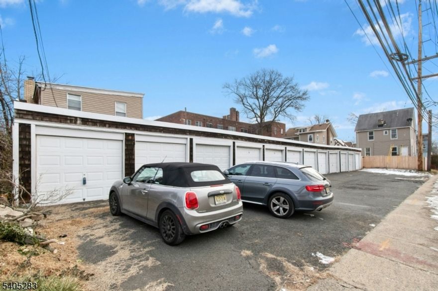 AMAZING & Unique investment property!  Call your investors, car collectors, landscapers or any business that needs storage and an income producing house. Better than a 2 family, market rate for the garages is $200 each or $2,400 a month.  Market rate for the house easily $3,000. total yearly gross income $64,800 potential. AMAZING RETURN! OR fill the garages with your equipment and live in the house, why pay for a storage facility? Currently 6 garages are rented below market with no lease. 3 are owner occupied.  House newly painted and carpeted.  new fence, new front porch and back steps. Gas, steam boiler and gas hot water heater.4 bedroom house with 1.5 baths.  private fenced rear yard. Walking distance to public transportation.