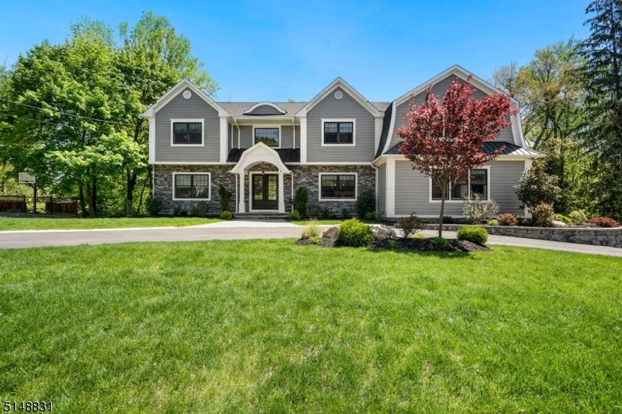 Stunning custom colonial home featuring the finest of finishes and modern amenities. This expansive home boasts 5 beds w/office & 5.5 baths which brings modern luxury, classic details, high-end craftsmanship and bright open floor plan. First floor offers an impressive foyer, soaring ceilings, gleaming wood floors ,magnificent moldings, custom built-ins, formal living & dining, inviting family room w/gas fireplace. Gourmet chef's kitchen with custom white cabinets, quartz counter, eat-in-kitchen, Wolf/Sub Zero stainless-steel appliances and center island. 1st floor en-suite, dedicated office and powder room completes this level. 2nd-floor features 4 bedrooms and a large laundry room. Spectacular primary bedroom designed w/tray ceiling, 2 walk-in closets & elegant spa bathroom w/soaking tub & double vanities. Finished walkout lower level is equipped w/huge recreation room, space for home gym, wet bar w/sink, lots of storage & full bath. This house offers central vacuum system/home speakers//wired Internet & cable /sprinklers. Exquisite outdoor space with expansive deck, gas line for BBQ and lush landscaping. Incredibly special and uniquely built home with no expense spared. This home is an entertainers dream and not to be missed!