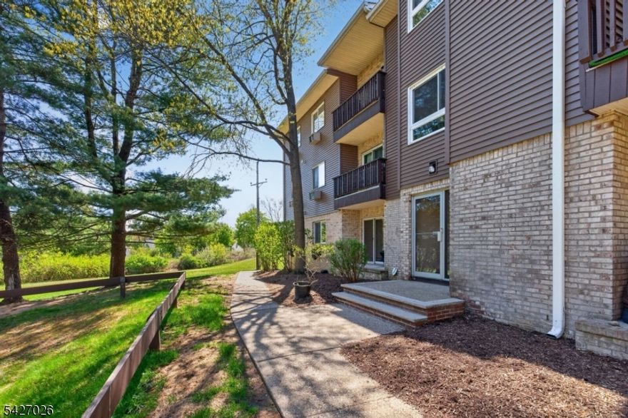 Welcome to this spacious 2 bedroom, 2 full bath, condo located on the first floor in Pompton Village. The open floor plan flows effortlessly from the living room through the dining area, into a kitchen with stainless steel appliances and granite countertops. The large primary bedroom suite features a private bath, and walk-in closet with built-ins. While the second bedroom, hall bath, and laundry room complete the easy one-level living. Newer washer, dryer, and a/c units plus freshly painted walls make it move-in ready. Outside you'll enjoy the park-like setting from your patio while being close to major highways, shopping, restaurants, and NYC transportation. This is the perfect location to make your next home.