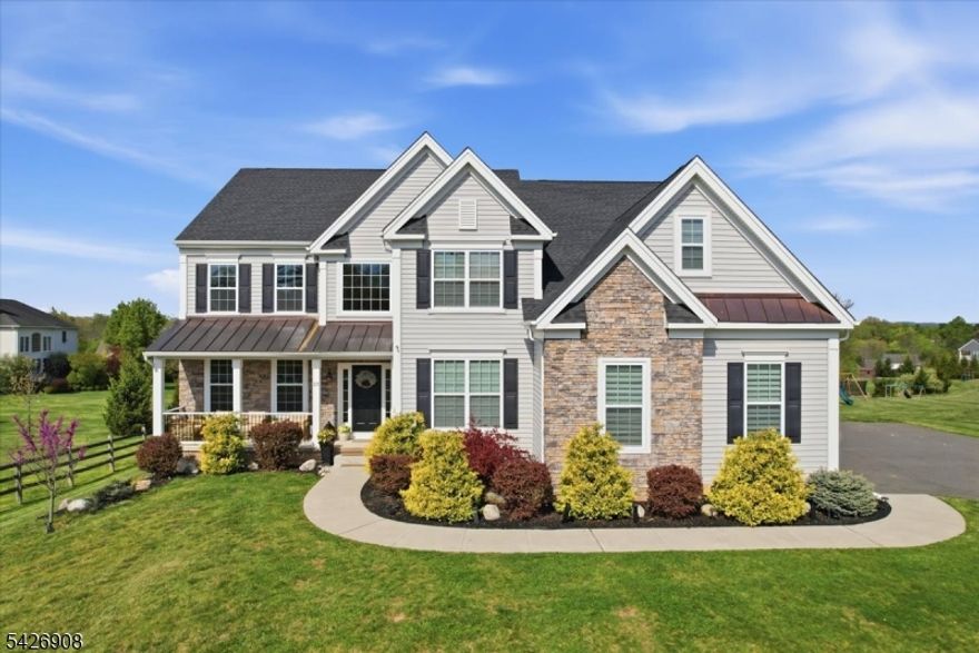 Experience the lifestyle you deserve in this picture-perfect Colonial. Offering four spacious bedrooms and four full baths, this home provides exceptional comfort for both everyday living and entertaining and even has an assumable 2.25% mortgage!  Entering the spacious 2-story entry foyer you can't help but notice the gleaming oak flooring throughout, reflecting the quality craftsmanship and attention to detail, complemented by over $21,000 in builder upgrades including a 9-foot basement with daylight windows. A convenient back staircase offers easy access from the upper level to the inviting expanded family room; and the private office is perfect for working from home!  The expansive chef's kitchen is designed to impress, featuring 42-inch cabinetry, pantry, center island seating, quartz countertops and a stylish tile backsplash. There is a full bath outside the office on the main floor, upstairs are 3 baths, including the "Jack n' Jill" bedrooms & the "Princess Suite". Step outside to your backyard retreat. A maintenance-free Trex  deck overlooks a beautifully designed Cambridge Paver patio, a heated saltwater swimming pool, two anchored pergolas, and a full outdoor kitchen. There is also an in-ground trampoline, and basketball court all within a fully fenced yard. The pool, designed with both comfort and safety in mind, is not only heated, it's just 5 feet deep and includes a slide, making it perfect for all ages!. Oversized 3-car garage and EV Charger t! Why wait? Call!