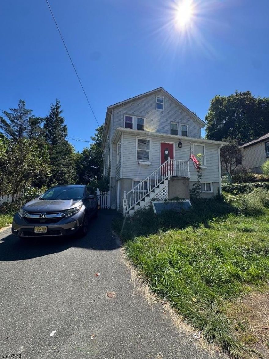 Modern home with eat in kitchen, Butcher block island, Granite Countertops. Separate pantry, Hardwood and Vinyl and Carpet Flooring. Four Bedrooms 2 Baths, 20X16 deck, Living Room, Dining Room, Fam Room, Kitchen on First Floor.