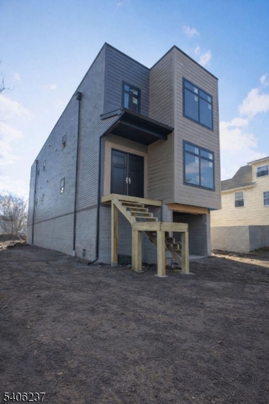 Welcome to this brand-new construction located at 132 Holsman Street in Paterson. This modern, move-in-ready home offers the perfect blend of style, comfort, and efficiency. Built to today's standards, the property features an open-concept layout filled with natural light, contemporary finishes.