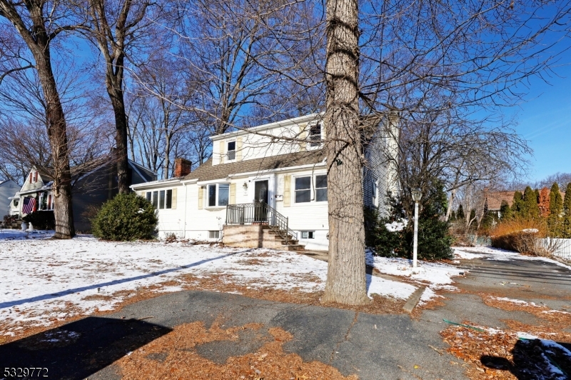 This renovated cape has four bedrooms and two bathrooms. The first floor features a living room with a fireplace, a dining room, a kitchen, a full bathroom, and two bedrooms. The second floor has two bedrooms and another full bathroom. There's also a full basement. The floors are made of hardwood. Multiple car parking space. Lake dues are appoximately $450 per year.