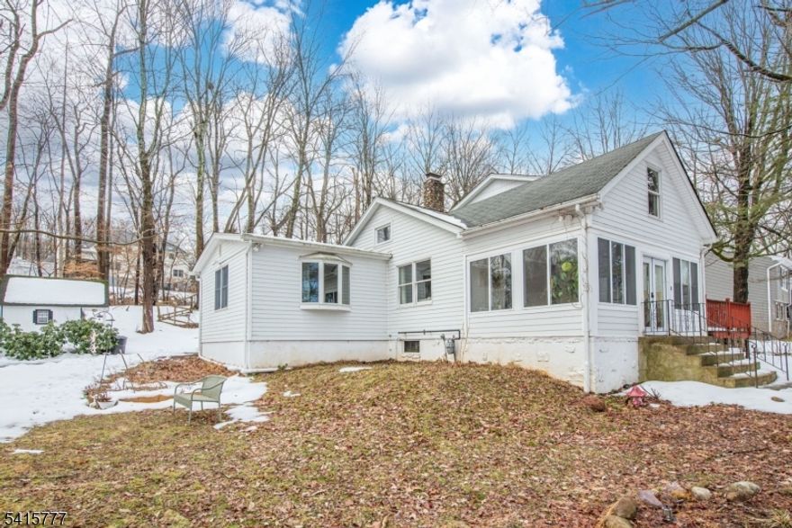 Wonderful 4 bedroom, 2 Bath unique & charming home located on a peaceful, bucolic lot.  The first floor of this home features a light filled living room with vaulted ceiling & stone fireplace, sunroom with access to the deck, kitchen with center island, formal dining room, family room, primary bedroom, 2 full baths, & second bedroom.  The second floor has a balcony overlooking the living room, 2 additional bedrooms and a rec room.  There is also a generator hookup, basement with plenty of room for storage and a utility room with new furnace.  The property includes a shed, two outbuildings with a fenced in area that could be used for pets or possibly chickens and a stream with a waterfall.  All of this is located close to shopping, parks, lakes, highways and transportation.