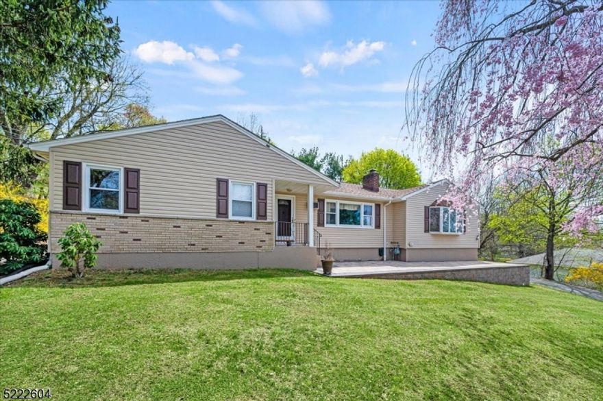 Sprawling Home with Room to Entertain in a Central Location! This spacious Ranch has lovely curb appeal, plus 4 bedrooms, 3 baths and multiple areas for entertaining. Past a welcoming foyer, you enter into the spacious living room with a bay window, recessed lighting, cozy wood burning fireplace and open flow into the dining room with plenty of space for hosting dinner. The eat-in kitchen boasts ample cabinetry and counter space, stainless steel appliances, and access to the huge Trex deck and tranquil backyard beyond with room to play, relax or garden, creating the perfect setting for summertime cookouts. The main floor continues with a sunny family room and an adjacent bedroom that's ideal as a private office or cozy den. The generously sized primary bedroom has recessed lighting and an en-suite bath. Three more bedrooms share use of an updated full hall bath with tub. More living space is in the lower level which offers a large, finished space with a built-in bar and lots of room for gaming tables or a media center - a prime spot for game night or low-key entertaining. The laundry room has an adjoining full bath, and there's ample storage space and access to the attached 1-car garage. With half an acre of meticulously landscaped property, this home sits mid-block in a quiet residential neighborhood of Randolph with great proximity to multiple parks, shopping and dining options, top-rated schools, and multiple highways for easy commutes.