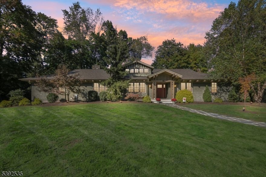 Beautifully designed and spacious Arts and Crafts Ranch ideally situated on a .41-acre corner lot in Summit's sought-after Franklin School District. This 5-bedroom, 3.1-bath home offers the perfect blend of classic design and modern comfort. Step inside to a bright, inviting layout featuring wide-plank hardwood floors and generously sized rooms that flow seamlessly across one-level living. The foyer opens to the formal dining room, which connects effortlessly to the gourmet kitchen and breakfast area, leading to the family room ideal for everyday living and entertaining.The kitchen, updated in 2023, features high-end stainless-steel appliances, a custom tile backsplash, center island, and French doors opening to the back patio. The spacious primary suite includes a beautifully appointed en-suite bath and ample closet space, while three additional bedrooms are conveniently located on the main level. A marble-tiled mudroom adds both function and style.The lower level offers flexibility with a family room, guest bedroom with full bath and steam shower, dedicated office space, wine cellar, and a sauna perfect for guests, work-from-home, or relaxation.Mature landscaping surrounds the home, complemented by a bluestone patio and gravel fire pit area ideal for outdoor entertaining. With its timeless appeal, thoughtful updates, and unbeatable proximity to Franklin School, downtown Summit, and NYC trains, this home truly checks every box. Showings start Thursday, 10/23.