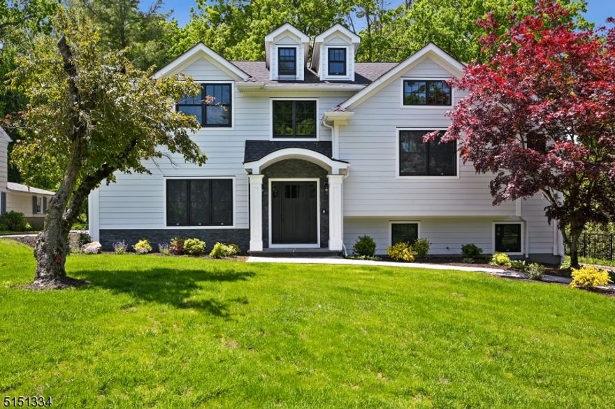 Custom 5 bedrooms 4 bathrooms, 1 half bath in the Poets Section of Short Hills with beautiful finishes. Find it close to the Hartshorn Elementary School, New York City midtown direct train, thriving downtown and the Short Hills Mall. The first floor in this thoughtfully planned home has a designed kitchen with upper scale SS appliances, a walk-in pantry, center island and breakfast nook all with quartz countertops.  To complete the first floor, a formal dining room, office, powder room and a family room. The second floor features an open loft area, and two very large bedrooms, each with a full bathroom. The primary suite finds a walk-in closet, full bath, separate shower and tub, and a double vanity. The third floor has two bedrooms, and shared full bath, along with a laundry room. Up a few more steps you will find another spacious loft. The finished lower level has a large open area, bedroom, walk-in closet and full bathroom. Add in a patio with a flat backyard, backed by a local golf course and you can relax in your new dream home in style.