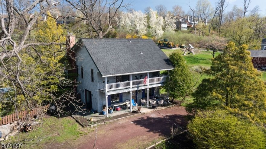 Situated on a generous 0.36-acre lot in the heart of Lambertville, 102 South Franklin Street presents an exciting opportunity to transform a home full of character into something truly special. This 2-bedroom, 2 full bath property offers a flexible layout and inviting spaces, ideal for those looking to add modern updates and personal style. The first floor features a comfortable family room, a bedroom, and a charming covered front porch perfect for relaxing and enjoying the surroundings. The second level offers a cozy primary bedroom with dual closets, an attached full bath, and access to a private balcony. Also located upstairs are the kitchen, living room, and dining room, with a rear porch just off the dining area, creating an easy flow for everyday living or entertaining. Outside, the expansive lot provides ample space and potential. The backyard includes an in-ground pool ready for a new liner and a fenced yard in need of replacement, offering the chance to create a customized outdoor retreat. A unique horseshoe driveway accommodates up to 10 vehicles, adding exceptional convenience. This home is truly a diamond in the rough, offering tremendous upside for those with vision. Ideally located near local dining, shopping, and popular events like Shad Fest, this property combines location, space, and endless potential.