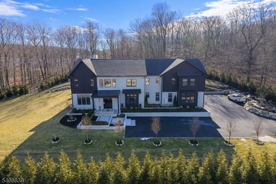 Brand-new, custom-built luxury residence showcasing high-end modern finishes throughout. Privately gated and set in a premier neighborhood, this exceptional home features soaring 10-foot ceilings, full smart-home integration, and a three-car garage. The resort-style backyard is designed for both entertaining and relaxation, offering a pool, putting green, and sand trap. Inside, enjoy a private movie theater and a state-of-the-art golf simulator?delivering an unmatched lifestyle experience in a top-tier setting.