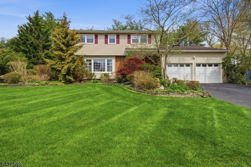 Over 2,300 sqft of comfortable living space in the desirable Colonial Oaks section. Ideally located in a charming neighborhood, this home blends timeless design with everyday functionality. Step inside to a classic, highly sought-after layout featuring a welcoming foyer, a sun-filled formal LR with a large picture window, a formal DR & a spacious kitchen designed for both daily living and entertaining, all overlooking the manicured backyard. A convenient PR & large pantry complete the main level. The inviting FR features a striking brick WB fireplace, direct garage access & sliders that open to the back deck, perfect for relaxing or hosting. Upstairs, you'll find 4 BDRMS & 2 full baths, including a primary with its own private bath. Gleaming HW floors, adding warmth & elegance. The BSMT offers exceptional versatility with a large rec space ideal for a rec room, gym, or playroom, an addtl room for a home office, plus unfinished space for storage & laundry, along with crawl space. Outside, enjoy a beautifully landscaped yard with mature plantings, perennial gardens & charming stone walls. The home's curb appeal is enhanced by a welcoming front porch, classic brick accents, shutters & a spacious driveway leading to a 2 car garage with loft storage. Located in East Brunswick, known for its Blue Ribbon schools, strong sense of community & excellent commuter access, this home is just minutes from shopping, dining & houses of worship. A perfect blend of space, charm & location.