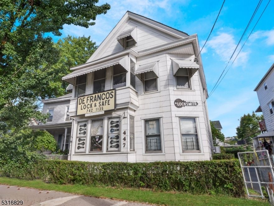 Don't miss this unique opportunity to own a piece of Paterson history!  Mixed use commercial / residential property on McBride Avenue!  Greet your customers into the business from the covered front porch  The first floor business offers a showroom space perfect for displaying all of your wares.  Behind the showroom discover an office, workshop and full bathroom complete with tub shower and sink.  The second floor offers a full apartment featuring 2 bedrooms, full bathroom, living room and eat in kitchen.  Access from the second floor apartment to the finished attic space, currently being utilized as a home office / workshop. The fully fenced in backyard offers ample space to enjoy outdoor grilling and your favorite backyard activities.