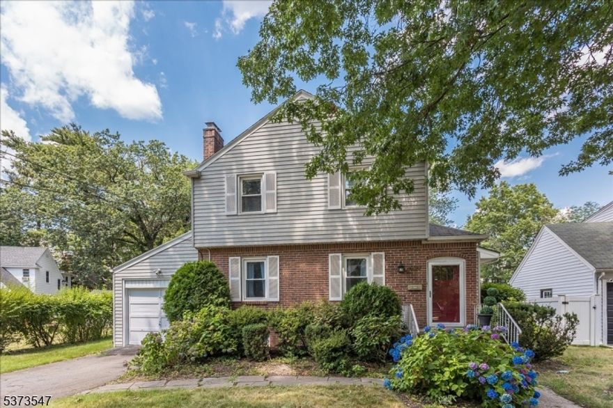 Amazing 4 bed colonial so close to center of Teaneck and 2 blocks to Cedar Lane.  Bus stop at corner of Kent and River and blocks to Terhune Park.  This home was lovingly cared for and the Living Room  has a gas fireplace and custom brick wall.  The Dining Room and Rec Room are adjacent and all have gleaming hardwood floors.  The Rec room has a 1/2 bath.  The kitchen is oversized with a separate eat in area granite counters and Recess lighting.  Plenty of light fills the Kitchen from the sliders to the back deck.  Upstairs there are 3 beds plus a Primary Bed Suite has magnificent Cathedral Ceilings and decorative beams that give it a lodge feel and very with a full bath. There is a full bath ensuite in the Primary Bedroom. The main Bath in the hall is available for the other Bedrooms. The Bedrooms have hardwood floors.  The basement is full and partially finished with a laundry room and 2 flex rooms to use to suit your needs.  Central air and public utilities and a whole house generator are the icing on the cake.  This great home will not last.