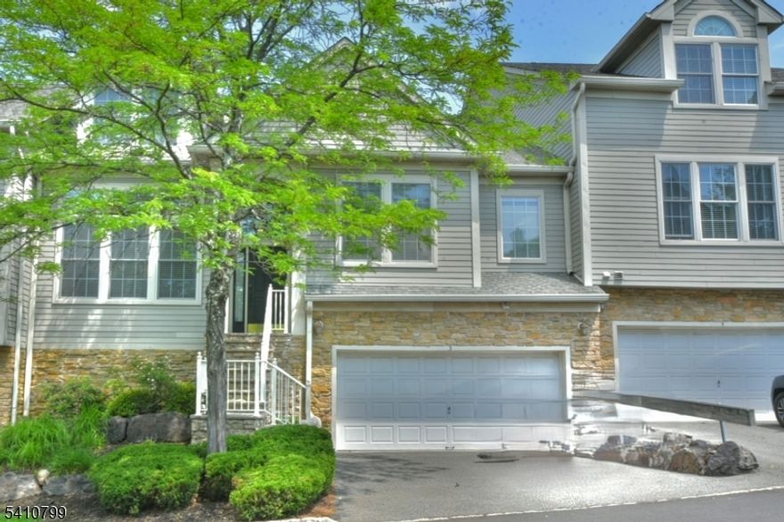 Townhome with Elegant Living Space .Upon entering, you'll be welcomed by a bright and airy foyer that leads into the dramatic two-story living room. The first floor boasts a spacious Primary Bedroom Suite featuring tray ceilings, a luxurious en-suite bathroom, and a large closet. The gourmet kitchen is equipped with stainless steel appliances and sleek granite countertops, while the adjacent family room and den offer plenty of space for relaxation and entertaining.Upstairs, you'll find two additional bedrooms with cathedral ceilings, a shared bath, and a loft that overlooks the stunning living room below. The lower level offers a generous recreation room, laundry room, ample storage space, and a utility room, with direct access to the 2-car garage.This home truly offers an unparalleled living experience.