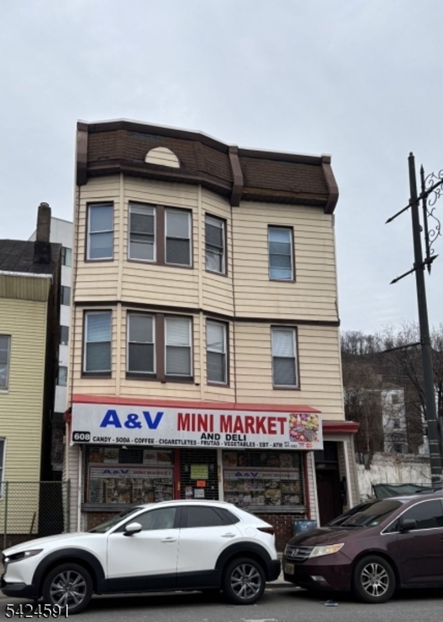 Great opportunity for investors with this mixed use property in Paterson. Store front Bodega in the first unit with 2 apartments in the upper level. Both apartments feature the same layout with living room, kitchen, 3 beds and 1 bath on each floor. Unfished basement for storage.
