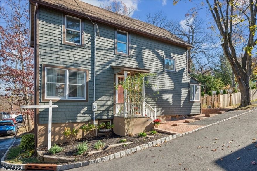 Welcome to this beautifully remodeled Colonial Victorian home in Mount Tabor, perfectly situated on a double corner lot. With modern updates & classic charm, this 3-bedroom, 1.5 bath home is designed for comfortable living-perfect combo of convenience, space, & character. Plus, it's mins from NJ Transit (direct to NYC), restaurants & shops. Step inside the living room, where natural light pours in creating a warm & welcoming atmosphere with classic details like large windows & recessed lighting. To the left, a finished sunroom perfect for a home office/den/playroom. Thoughtfully designed half bath/laundry room sits just off the sunroom. The spacious formal dining room has large sunny windows & sliders to private backyard, offering a fully fenced yard, spacious deck, paver patio, & firepit area-ideal for outdoor entertaining & relaxing. At the heart of the home is the chef's kitchen, fully equipped with modern appliances, soapstone countertops, & central peninsula ideal for meal prep & casual dining. Access to backyard via finished mudroom. Upstairs, find 3 well-appointed bedrooms, each offering hardwood floors, large windows & recessed lighting and a full bath with shower/tub Complete this floor. Additional features: 2 zone Central AC, 2 zone FHA heat, basement storage, & 3 off-street parking spots! With its unbeatable location, spacious layout, & timeless charm, this home is truly a rare find. Don't miss the opportunity to make this stunning home yours today!