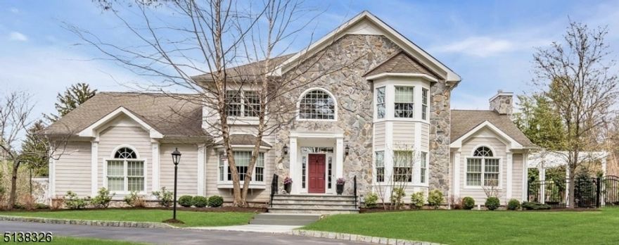 Stunning, bright 11 yr young 5 BR 4.1 Bath Colonial. The striking curb appeal of the majestic stone front entrance welcomes you home. As you step into the gracious foyer, you immediately feel the thoughtful design and open flow of the home. The stylish Kitchen, with its beautiful custom cabinetry, high end stainless steel Thermador appliances and seated center island, is ideal for entertaining. It opens to the Family Room with soaring cathedral ceilings, bar area, gas fireplace and 2 sets of sliders which flow onto the patio with pergola and the fabulous fully fenced in private yard. Spacious Formal DR, LR/Office, walk-in Pantry and Laundry Rm/Mudroom complete the first floor. All 5 BRS are located on the second floor. Primary BR offers beautiful Master Bath retreat and walk in closets. Second staircase leads to BR and Full Bath which would be perfect for au pair or in-law suite. Basement, with high ceilings, was finished 9 years ago with a Home Theater Rm, Game Rm, Flex Rm with attached Full Bath. Additional highlights include: mature, professional landscaping, central vacuum, 2 zoned heating and cooling, whole house generator, solar panels which cover the electric bill and generate SREC income (owned, not leased), WiFi enabled exterior sconces, built-in speakers, wired for internet throughout the house and an oversized 3 car garage with EV charging station. Home warranty included. Make 5 Dogwood Drive your new dream home!!!