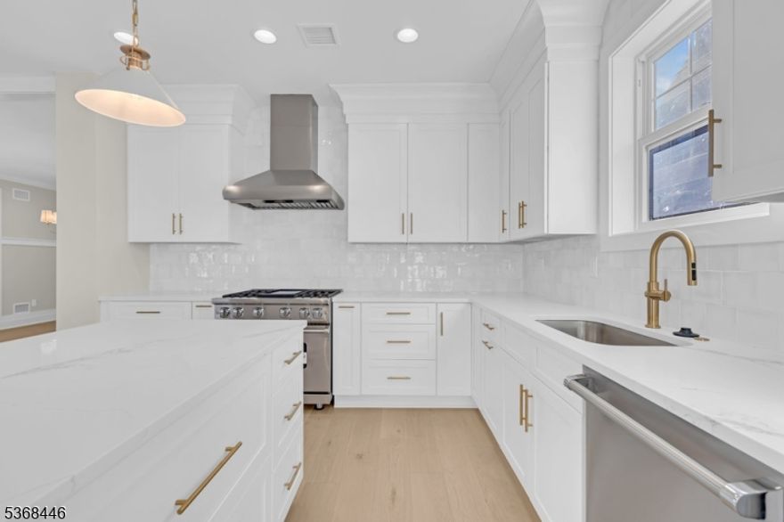 This new construction home in Madison offers an unbeatable value and an incredible opportunity to own new construction in Madison! Boasting 5 bedrooms, 3.1 bathrooms, and nearly 3,500 square feet of beautifully designed finished space, it's truly one of the best offerings in town. The first floor showcases a thoughtfully designed open-concept layout, perfect for modern living and entertaining. It features a spacious living and dining area, a large center island, and a beautiful kitchen outfitted with a premium Viking appliance package, combining top-of-the-line performance with sleek, modern design. A powder room and mudroom add convenience and functionality. Upstairs, you'll find four generously sized bedrooms and two full bathrooms, including a phenomenal primary suite with a luxurious en-suite bath and a gracious walk-in closet. The fully finished basement adds nearly 1,100 square feet of additional living space, complete with a fifth bedroom, full bath, and a large rec room, providing plenty of flexibility for a home office, gym, or guest suite. Don't miss your chance to make this your dream home in one in of the most desirable towns in NJ.