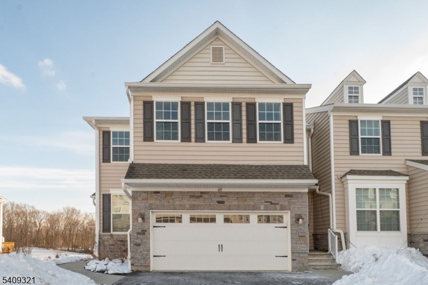 Welcome to this stunning 3-bedroom, 3.5-bath end-unit NE facing townhome, offering loads of privacy with beautiful natural light from three sides! This home features an open-concept main floor with upgraded flooring, a spacious great room and a chef's kitchen featuring upgraded appliances, large center island, custom cabinetry and a private deck to relax & unwind. Upstairs, the primary suite boasts a walk-in closet, large ensuite bath with step in shower, custom tray ceiling, large windows and recessed lighting. The 2 additional bedrooms have a Jack and Jill full bathroom, and the loft adds additional space for a game or computer room. The true highlight is the fully finished daylight basement, providing flexible space for a home office, gym, or entertainment room, full bathroom, extra storage and has direct walkout access to a private patio. Located near NYC buses, shopping and lots of dining options!