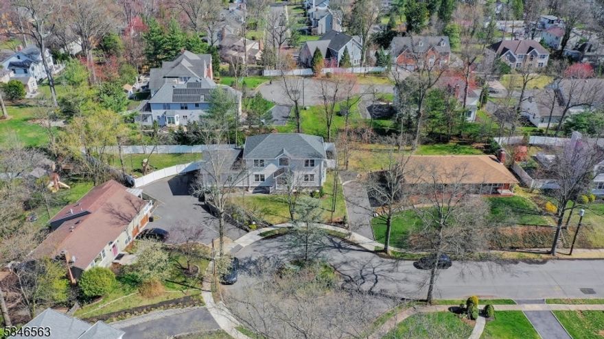 Tucked away at the end of a serene cul-de-sac, this stunning home is a showcase of modern elegance & exceptional craftsmanship located just blocks from all schools K-12, Tamaques Park, town/train. Step into a breathtaking two-story foyer that seamlessly flows into a thoughtfully designed open-concept living space. The state-of-the-art kitchen is a culinary dream, featuring top-tier Bertazzoni and Viking appliances, a spacious center island, and custom-crafted wood cabinetry. The family room is warm and inviting, highlighted by a sophisticated leathered granite gas fireplace, while the formal dining room boasts a sleek wet bar, perfect for entertaining.  The main level also offers a 1st floor bedroom suite, a stylish home office, den, & a well-appointed mudroom. Upstairs, the luxurious primary suite awaits, complete with dual walk-in closets & a spa-inspired ensuite bath. 3 additional bedrooms provide ample space & comfort. The finished basement expands the living area, offering a vast rec room & an additional full bath. High coffered ceilings, wide-plank white oak flooring, Hardie Plank siding, & intricate custom moldings add to its refined character & make this home a true masterpiece, built with uncompromising attention to detail. Constructed on an expanded foundation, this residence offers an impressive amount of living space. Upgrades since purchase incl fence, pergola + bigger patio, landscaping, ev charger.  A rare gem that blends sophistication with everyday comfort!