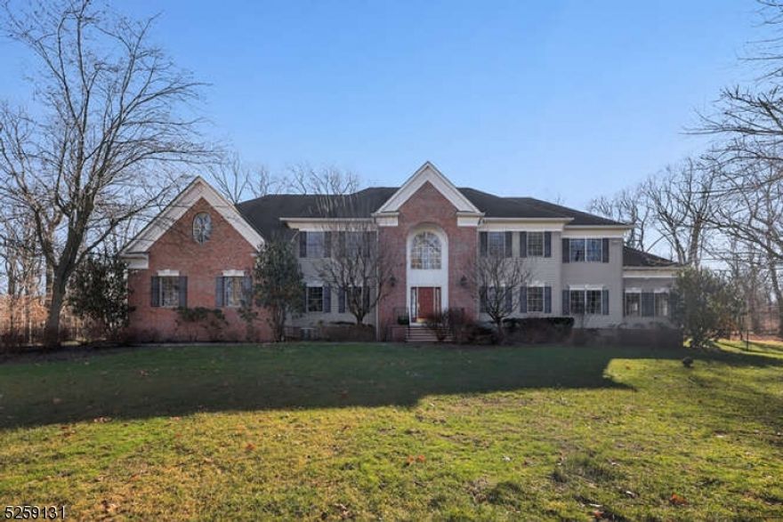 Welcome to this stately 5BR, 3.1BA Colonial home, 4,999 sq ft of luxury living space, set atop the picturesque Watchung Mountains. Located on a cul-de-sac on 2 acres, this home showcases a blend of luxury and warmth, featuring hardwood floors on both levels, spacious formal LR, DR & a cozy sunroom with a wall of windows to enjoy the outdoors! Gourmet kitchen, the heart of the home, is fully equipped with top-of-the-line appliances, including a Sub Zero refrigerator & Viking range, all complemented by granite counters & center island w/ breakfast bar. Sunny dining area with sliders to the maintenance-free deck, is perfect for enjoying the very private, tranquil, fully fenced-in backyard. Open concept floor plan leads to gracious family room, adorned w/ fireplace and provides an inviting space ideal for gatherings. Two beautiful home offices offer flexibility & functionality for today's work from home lifestyle. 2nd fl offers 5 BRs including the spacious & luxurious MBR suite, boasting tray ceiling, 2 walk-in closets & an the 2nd office/exercise room! 4 add'l bedrooms are paired with two attached "Jack 'n Jill" bathrooms. Large unfinished basement has very high ceilings & opens the door to endless possibilities. Other features include a full house Kohler built in generator, 3 car garage, paver driveway & public water and sewer! Don't miss the chance to call this meticulously crafted residence your new home, where comfort, style, and functionality converge seamlessly.