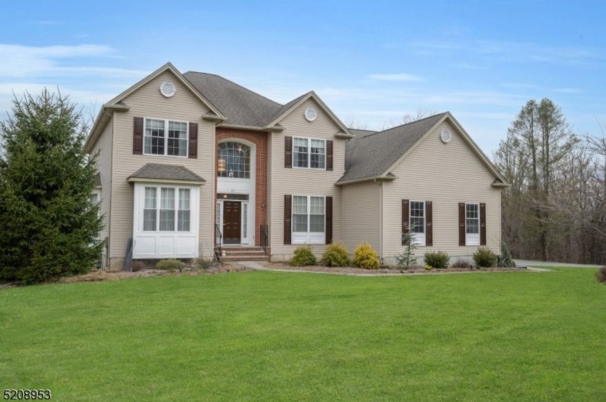 Fabulous younger colonial on Schooleys Mtn has beautiful landscape, privacy and large usable backyard! Two story foyer features transom window for extra natural light and extensive moldings.  French double doors lead to first floor office/study with hardwood flooring, perfect for working from home! Step down family room with pellet stove insert is open to the cook's delight center island eat-in kitchen.  Stainless appliances, granite countertops, maple cabinets, pantry and large breakfast area with sliders to deck complete the space.  Formal living and dining rooms feature hardwood flooring, moldings and tray ceiling, perfect for entertaining!  Primary bedrooms suite offers a large sitting room, tray ceilings, 2 walk-in closets and luxurious bath with jetted tub and stall shower, double vanity and linen closet.  Three additional large bedrooms and main bath with double vanity and laundry room complete the bedroom level.  Other features include walk-out basement with rough plumbing for bath and high ceilings, above ground pool with newer liner and pump, 3 car garage, HVAC systems less than 2 years old, pull down stairs to attic storage, plantation shutters, first floor powder room, 3+ acres, Long Valley schools and West Morris Central High School with IB program together make this your perfect next home!