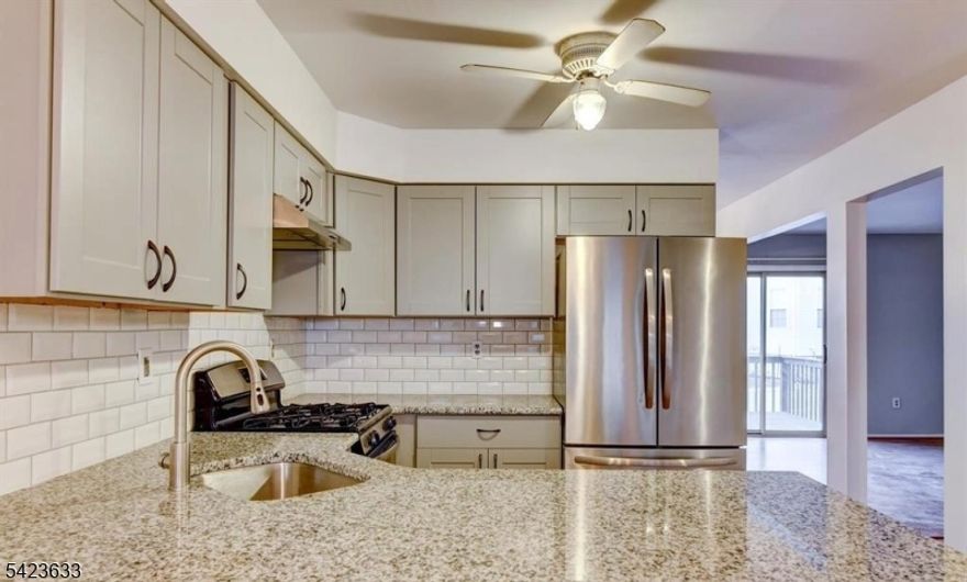 Welcome to this beautifully upgraded townhouse located in the highly desirable Renaissance community in the heart of North Brunswick. This spacious 3-bedroom, 2.5-bath home with a finished basement and attached garage offers the perfect combination of comfort, style, and convenience. The open-concept living and dining areas create an inviting atmosphere ideal for everyday living and entertaining. The renovated kitchen features gorgeous granite countertops, elegant cabinetry, a stylish backsplash, an undermount sink with contemporary faucet, and stainless steel appliances, including a newer refrigerator (approximately 2025). Upstairs, the primary bedroom suite offers a dramatic vaulted ceiling, a large walk-in closet, and a private ensuite bathroom complete with a soaking tub. Two additional bedrooms and a conveniently located laundry area complete the upper level. The main bathroom and powder room have both been tastefully updated. The finished basement provides valuable additional living space and is perfect for a recreation room, home office, gym, or media area. Fresh interior paint adds to the home's bright and updated feel. Ideally located just minutes from major highways, shopping centers, restaurants, and everyday conveniences, this home offers both comfort and accessibility. Note: Photos are from the previous listing. The home has been repainted since these lphotos and refrigerator has been replaced (different from the photo)