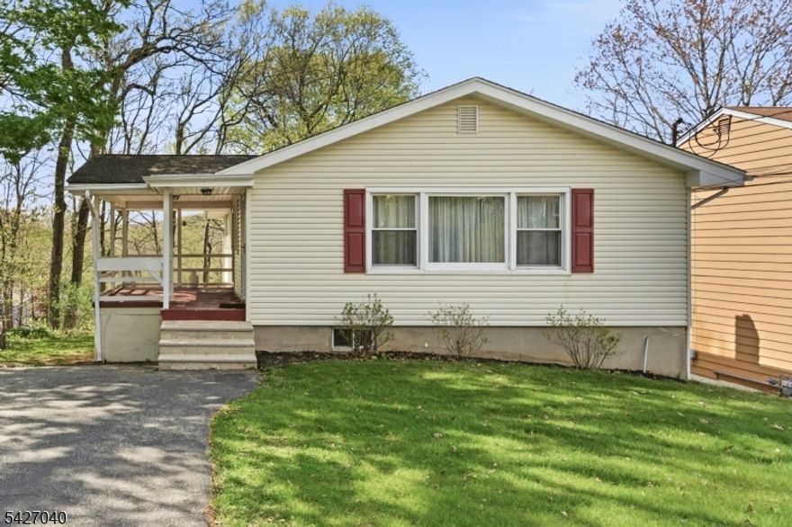 Wonderful new listing in desirable White Meadow Lake! This beautifully maintained ranch-style home is the perfect opportunity for a first-time buyer or anyone looking to downsize without sacrificing space. This lovely home has much to offer. Featuring nicely sized rooms and a bright, open floor plan, the updated kitchen has plenty of counter space and cabinetry, making it easy to entertain. The kitchen flows nicely to the dining area. Enjoy hardwood flooring, thermal windows, and a finished walk-out basement offering additional living space plus ample storage. Step outside to the inviting front porch or relax in the private, level, wooded backyard, your own peaceful retreat. Located in the highly sought-after White Meadow Lake community, residents enjoy year-round activities, including boating, kayaking, and pickleball, as well as a vibrant clubhouse. Come join a committee, meet new friends, and live the best "Lake-Life . There's truly something for everyone!