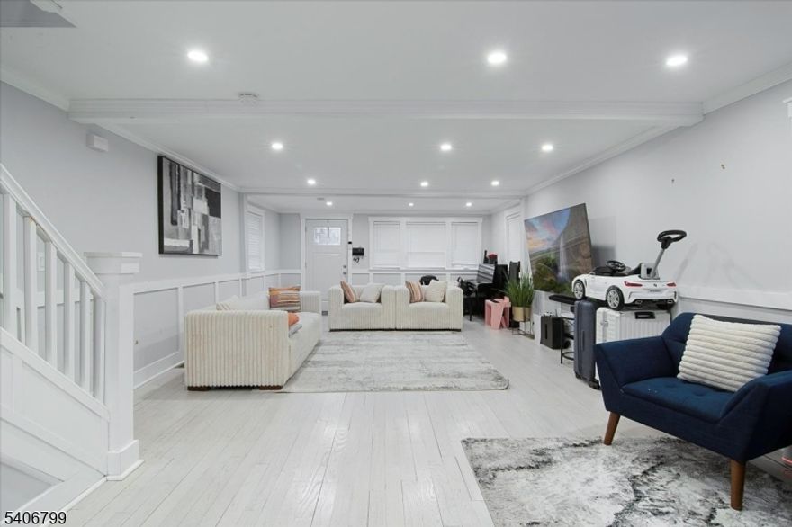 Experience refined living in this meticulously renovated 5-bedroom, 3.5-bath single-family home in East Orange. This thoughtfully redesigned colonial home features a modern kitchen with a center island, stainless steel appliances, quartz countertops, and chic contemporary finishes. White oak flooring flows throughout, complementing the homes bright and spacious layout. Fully finished basement with laundry and a full bath, offering guest accommodations. Spacious bedrooms provide comfort and flexibility, while the backyard with a deck creates a perfect setting for outdoor entertaining and relaxation. Ideally located near NJ Transit with effortless access to NYC, and just moments from schools, dining, and everyday conveniences. This turnkey residence delivers the perfect balance of luxury, space, and location. Dont miss this exceptional opportunity!