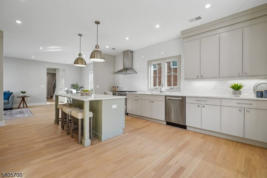 NEW PRICE. YOU ARE INVITED !  WELCOME TO LUXURY LIVING IN THE HEART OF PRESTIGIOUS MILLBURN. THIS HOUSE WAS EXTENSIVELY RENOVATED WITH THE BEST QUALITY IN 2025/2026. THE FIRST FLOOR OFFERS AN ELEGANT GOURMET KITCHEN WITH CUSTOM CABINETS, QUARTZ COUNTERTOPS, STAINLESS STEEL APPLIANCES AND A LARGE CENTER ISLAND, LIVING ROOM-DINING ROOM OR USE IT AS AN INFORMAL LIVING SPACE SUITABLE FOR YOUR LIFESTYLE, HALF A BATH AND A PRIMARY BEDROOM WITH A PRIVATE BATH. SECOND FLOOR HAS A PRIMARY BEDROOM WITH PRIVATE BATH, 2 ADDITIONAL BEDROOMS, A FULL BATH AND CONVENIENT LAUNDRY ROOM. THIRD FLOOR HAS AN EXPANSIVE GAME ROOM WITH FULL BATH. OUTSIDE HAS A LONG DRIVE-WAY TO ACCOMODATE MANY CARS, 2 CAR GARAGE WITH OPENER, A LEVEL YARD WITH GRASS AND A SPACIOUS PATIO FOR ENTERTAINMENT. THE PROPERTY IS POSITIONED IN CLOSE PROXIMITY TO THE DIRECT TRAIN SERVICE TO NY CITY, CENTER OF TOWN, COMMUNITY PARKS, MAJOR HIGHWAYS AND THE PAPER MILL PLAYHOUSE. LET'S NOT FORGET - TOP RATED SCHOOL SYSTEM. ...COME, WE ARE WAITING FOR YOU!