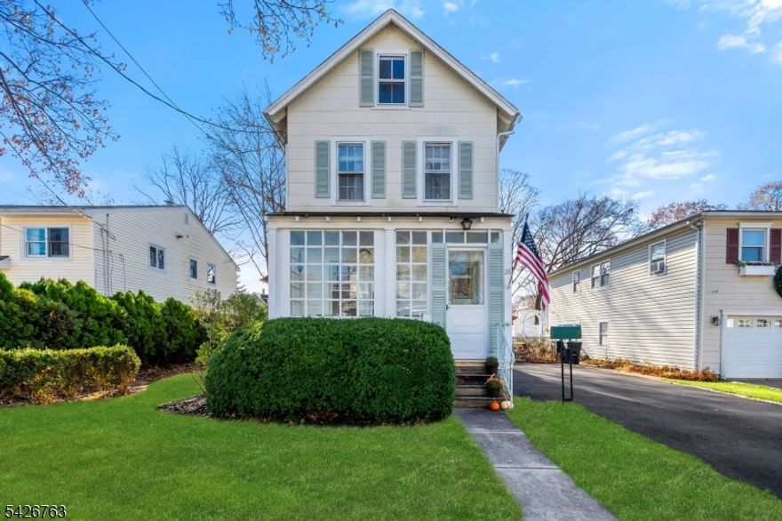 Welcome to your newly updated, charming home located in a great neighborhood! This 3-bed, 2-bath Colonial combines both modern feel and comfortable living located in the highly desirable town of Morris Plains. The home starts with an inviting front sun porch, ideal for both that morning coffee or a nice read. Through the front door you enter into the cozy living room for those highly anticipated, low-key, movie nights. Next we have the heart of the home, a newly renovated kitchen masterpiece, which boasts quartz countertops, full glass door cabinets, LED undercabinet lights, stainless steel appliances, and most importantly, in-ceiling speakers for all your upcoming social gatherings! Into the dining room we go, with a first floor bedroom and fully updated bathroom just off to the left. With a clawfoot tub to soak in after those long weeks, it really is a treat. Then straight to the back out the slider we go to a spacious deck, perfect for all kinds of outdoor entertaining. Upstairs, the primary suite offers a peaceful retreat, a second fully updated full bathroom, and third bedroom. The exterior features a front, side and large back lawn, which is completely enclosed by fence, along with a favorably sized driveway. Experience suburban peace while being minutes from local amenities, top-rated schools, parks and train/bus service to NYC, and just minutes to historical and trendy Morristown. Don't miss your chance to own this ideally situated, one-of-a-kind home!