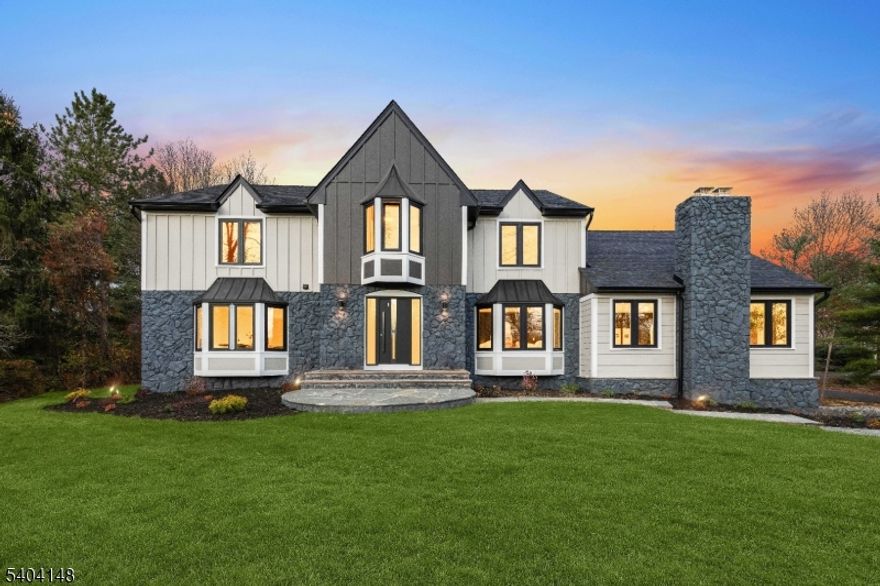 This fully reimagined luxury residence offers exceptional privacy and modern sophistication just five minutes from Morristown Center, Whole Foods, and mass transit. A long driveway leads to an impressive three-car garage with CHI doors. Every detail has been thoughtfully built, including mechanicals, plumbing, and electrical systems. The home features six bedrooms, five and a half baths, multiple gas fireplaces, and European windows providing superior insulation and comfort. The custom Italian kitchen includes paneled Miele appliances,a hidden vented hood, and a Taj Mahal honed quartzite island and backsplash.The primary suite boasts elevated ceilings, a spacious Pianca custom walk-in closet, and a spa-inspired bath shower system, stone double vanity, Toto toilet, and solid soaking tub. A full finished basement, European composite deck, and manicured landscaping complete this remarkable reimagined home that blends timeless design with modern luxury.