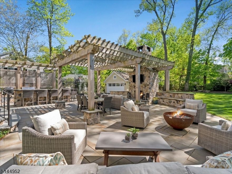 Outdoor entertainers paradise in a completely renovated home that encompasses the character, charm  and workmanship of a classic home. Live the dream in this exquisite 5 bed, 6.1 bath located on a prestigious street near downtown and walk to schools. This home is the best of both worlds, NEW  but showcases sophisticated  character with its millwork, stone, coffered ceilings, wood beams. and 4 fireplaces. Impressive first floor which includes formal living room, dining room and home office/whiskey tasting bar room that features custom built in and 2 wine refrigerators. Wide hallways lead to a spacious and bright kitchen equipped with Theramadoor appliances. Front and back staircases lead to second floor with bedrooms (all have their own bathrooms), guest suite, master bedroom and laundry room. Third floor can be used as more guest space/rec room/office or gym with its own bed and bath. The backyard will remind you of your trip to Napa with a woodburning stone fireplace, full outdoor kitchen/bar that has a griddle, smoker, grill, and fabulous  concrete counter designed to look like wood.  The yard also hosts a large blue stone patio with pergola and gas firebowl designed by an artist. Bathrooms are tiled with beautiful marble and stone. Basement has high ceilings and  tons of room to play, storage and wine cellar.Brand new audio and video security installed. Don't miss the huge mahogany front porch for sipping coffee and wine. This home is a SLAM DUNK!