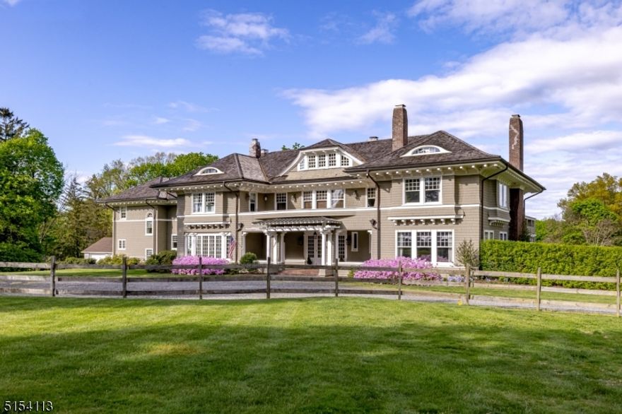 The "Dean Sage Residence," circa 1904, is a landmark estate that has graced the streetscape between Mendham and Bernardsville for over one hundred years. Today, it continues to serve as a premier example of the Shingle-style of architecture that was popular during the turn of the last century. Exquisite architectural details are found throughout the residence, including eight fireplaces and original millwork.  Under the stewardship of the current homeowners, many of these architectural elements have been restored to their former glory.  The floor plan unfolds from a thirty foot entry hall with hand carved moldings and a beautiful fireplace, providing the ideal venue for entertaining on a grand scale.  Pockets doors on each end of the hall glide open and allow a view of the living room and dining room, while French doors and new windows in the hall offer views of the pool and terrace.  A newly constructed side porch was built from an original design. This delightful porch overlooks the restored formal garden, amidst sounds from a new stone fountain.   A library, gourmet kitchen, family room and two powder rooms complete the first floor.  The primary suite fills one wing of the second floor and offers two luxurious bathrooms and two fitted dressing rooms.  Two of the four additional bedrooms on the second floor feature fireplaces and en suite bathrooms. A sixth bedroom with adjoining bath and sitting room is on the third floor. The three-car detached garage is over a bank barn.
