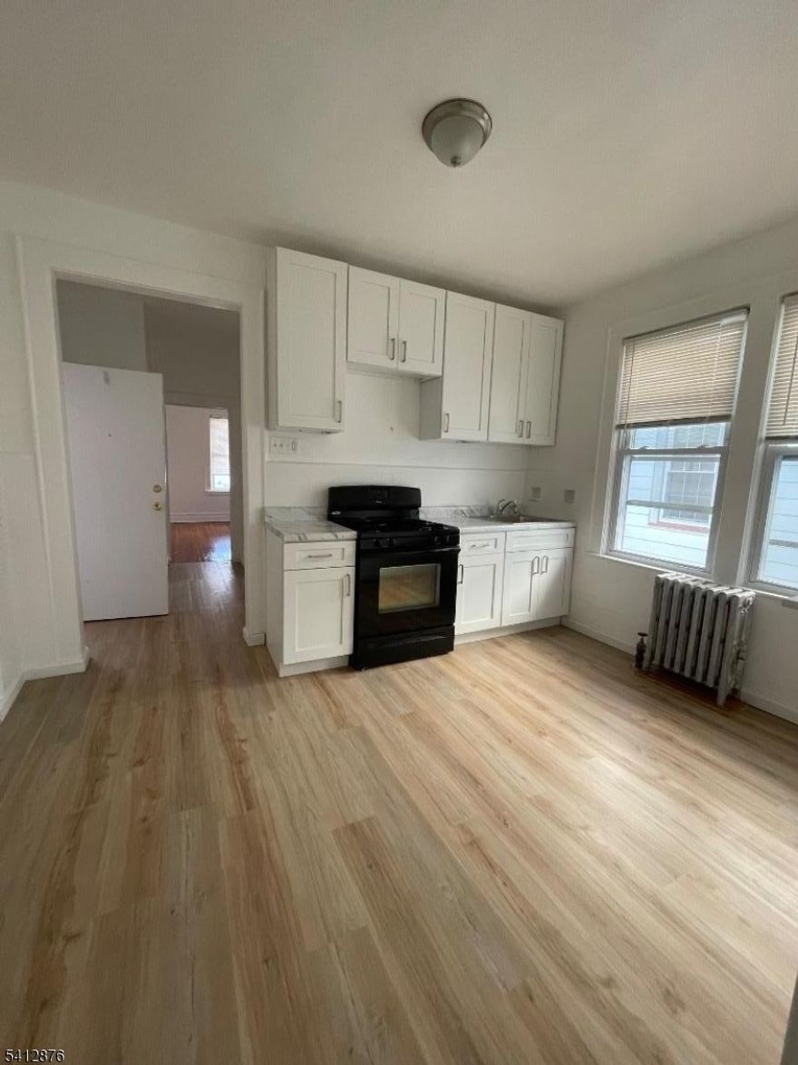 Welcome home to this beautifully renovated 3 bedroom apartment, perfectly situated in the vibrant city of Newark, New Jersey. Located on the second floor, this residence boasts elegant tiles and hardwood floor, a modernized kitchen, and a freshly updated bathroom, offering a stylish and comfortable living space.Conveniently located within a 25-45 minute drive to New York City.