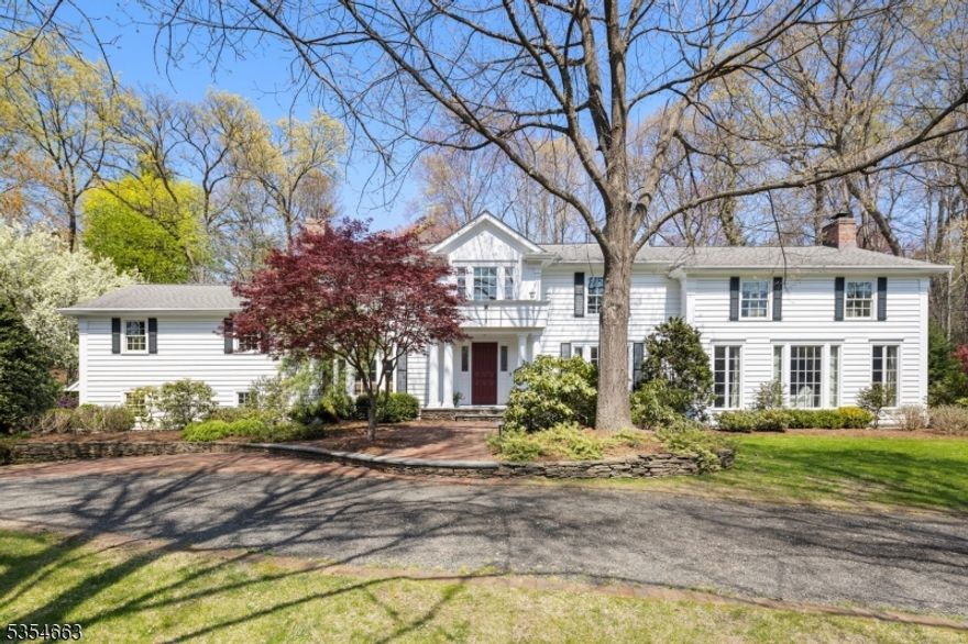 A Rare Opportunity in Wyckoff's Prestigious Knolls Section! Welcome to your dream home-ideally located on a quiet cul-de-sac across from scenic Rambaut Lake. This beautifully renovated residence offers nearly 5,000 sq. ft. of elegant living space on approx .75 acre, featuring 4 spacious BRs, 3 fbths, and 2 half baths. Step into your private backyard oasis, complete with a heated saltwater in-ground pool, multiple bluestone patios, covered porch w/wet bar and plenty of areas to relax, entertain, and enjoy life outdoors. The main level features A stunning great room w/fp, elegant banquet-sized dining room w/fp, Sun-drenched custom Ulrich kitchen w/ expansive windows, 2 PR's,Spacious library w/fp, built-ins, and a wet bar. Upstairs, retreat to your luxurious primary suite w/ Private sitting room, 2 WICs, A spa-like bath with upscale finishes. Three additional bedrooms, two full baths, walk-in linen closet complete the second level. The finished basement offers a fun and flexible family room, laundry area, ample storage and steps to garage. Addl feat inc: 3 fireplaces, whole house generator, Ecar charger, Multi-zone heating/central A/C, water softener, Gleaming hardwood floors, circular driveway . Come tour today, and fall in love with a home you'll never want to leave!