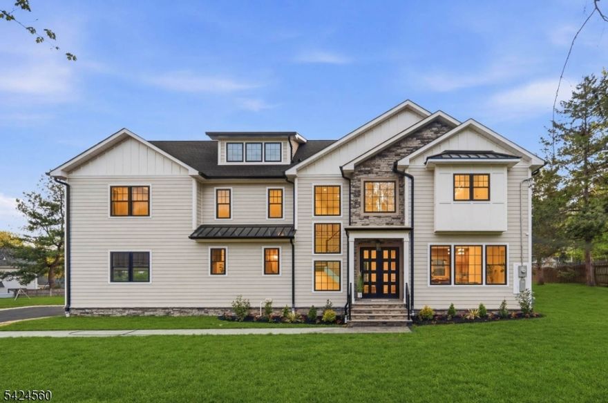 Welcome to this exceptional home set on a .32-acre lot, tucked away on a quiet cul-de-sac in one of Scotch Plains? most desirable neighborhoods. Offering approx. 4,600 sq ft across three finished levels, the home opens with a grand two-story foyer, 10-ft ceilings, elegant spaces, and seamless flow. The formal dining room is ideal for entertaining, while the gourmet kitchen with quartz countertops, stainless steel appliances, and butler's pantry opens to a dramatic two-story family room with statement fireplace and sliders to the patio. A well-designed mudroom and walk-in pantry are both conveniently located off the garage entry, enhancing everyday functionality and storage. Upstairs, the primary suite features a spa-inspired bath and his-and-her walk-in closets. Three additional en-suite bedrooms, a home office, and second-floor laundry complete this level. The finished lower level offers a rec room, playroom, bedroom with full bath, and walk-in closet-ideal for guests. Designed for today's lifestyle, this home includes a smart thermostat, EV charger outlet, and built-in speakers in both the family room and basement. The flat backyard offers ample space for a future pool and outdoor entertaining. Enjoy access to the highly regarded Scotch Plains-Fanwood school district, nearby parks and nature trails, vibrant local dining, shopping along Rt 22, major highways, and a short drive to NYC train service. Complete with a 2-car garage and a 10-year builder's warranty.