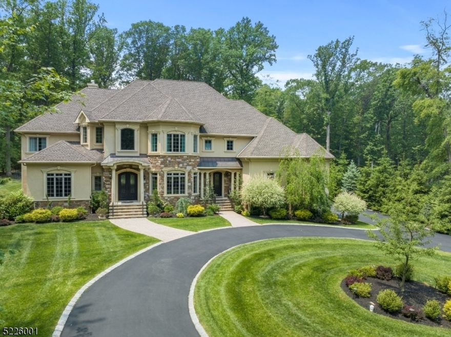 Welcome to this exceptional custom colonial home in one of Warren's most desirable locations. This beautifully maintained home offers luxury living with fine finishes and exquisite details. From the recessed LED lighting to the crown moldings, every aspect of this home exudes elegance. As you step inside, you'll be greeted by a grand entry foyer adorned with medallions on the floor and ceiling, complemented by a sweeping staircase. The open floor plan seamlessly connects the main living areas, including a one-and-a-half story living room with a tray ceiling and a dining room that can accommodate all of your guests. The centerpiece of the home is the two-story great room, featuring a coffered ceiling, a custom paneled gas fireplace, and floor-to-ceiling windows that overlook the private backyard and woods. French doors provide access to the deck, perfect for outdoor entertaining. The gourmet kitchen is a chef's dream, boasting two center islands, top-of-the-line stainless steel appliances, a copper farm sink, and granite countertops. A glass pocket door leads to a butlers kitchen with additional appliances and storage. The first floor also includes a guest suite, library, powder room, and a mudroom. The second floor has four bedrooms, three bathrooms, a laundry room, and a bonus room with skylights. Don't miss the opportunity to make this remarkable custom colonial home your own. It offers a perfect blend of luxury, functionality, and sophistication in an unbeatable location