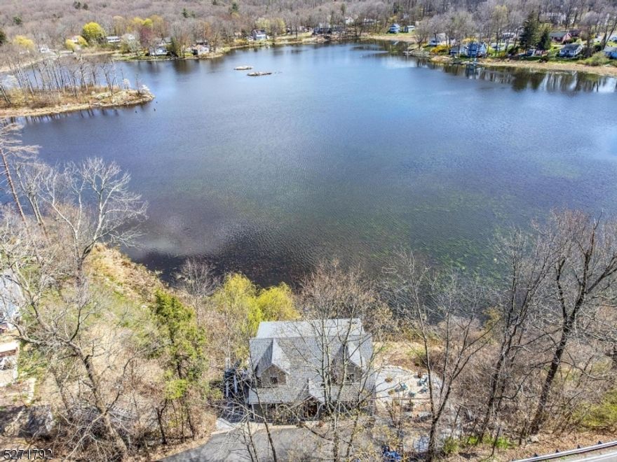 This is the home you've been waiting for! Completely rebuilt in 2020 with all modern style and luxuries!  Views of Lake Wanda from every room, luxury vinyl flooring in kitchen and baths, wide plank pine flooring throughout living spaces and bedrooms, kitchen with breakfast bar, pine ceiling, quartz countertops, double wall oven, stainless farm sink and appliances, living room with woodburning stove, primary bedroom has pine ceiling and walk-in closet, under eaves storage.  Decks and patio on 3 levels, central air, low maintenance vinyl exterior, paved driveway and more!  Perfect 2nd home or for year round living!