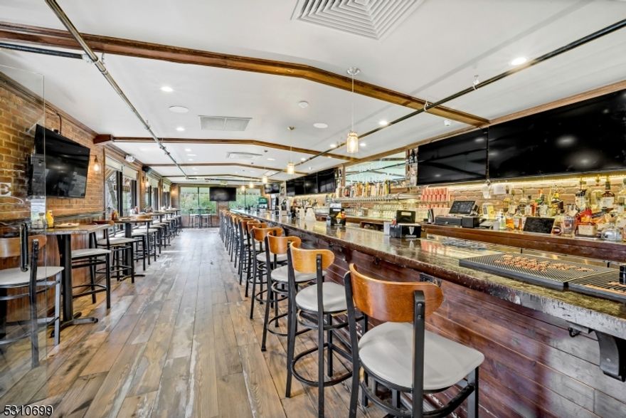 Sale includes property, liquor license and business. This 150 seat, beautifully gut renovated restaurant has 4 dining ares plus a full bar with high top tables around  the perimeter. There are also fully approved plans to build a 14'(w) x 52'(L), 52 seat outdoor dining area in either concrete or wood in the front of the building. There is a full height basement with 2 bilco-doors for loading that house a walk-in keg fridge, liquor cage, large office, abundance of storage, multiple freezers, a gym and more storage then you can imagine. The restaurant and full height basement consist of 5,000sf each.