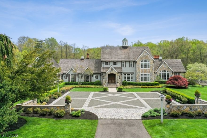 This is your Dream Estate! "Moggy Falls" is ideally set on 14 acres of breathtaking property just 45 minutes to NYC! This magnificent estate is perfect for multi generational living has walking & jogging trails along the perimeter, waterfall, formal gardens, salt water pool & state of the art pool house with stunning kitchen, bath & yoga studio. 6 garage bays await the car enthusiast. Every room is an architectural masterpiece in this Custom built 16,000 sq ft home . Stunning gourmet eat-in kitchen with 13' vaulted ceiling w/ exposed trusswork, 5 skylights, best of the best appliances, open to 14' domed breakfast room w/ floor to ceiling windows & stunning great room. Dining room is of grand proportion with fine woodwork & great natural light, perfect for entertaining. Sunroom features fireplace w/stone surround & radiant heated natural stone flooring. Wine room w/ Old World feel of a British Social Club. Stunning Garden Room. Spectacular 1st floor Primary Suite w/ 12' vaulted ceiling, 2 massive walk-in closets, an exercise room with juice bar & new spa-like Primary Bath w/ radiant heated floors, walk-in steam shower & jetted tub, & oak paneled home office with wood-burning fireplace. 3 more ensuite bedrooms on 2nd level, 3rd level playroom/study, entire guest wing & private caretakers apartment. Lower level features a recreation room (40' x 20') with wet bar, & screening room w/ 13 chairs in stadium seating, 8' projector screen and flanking marble columns. A must see estate!