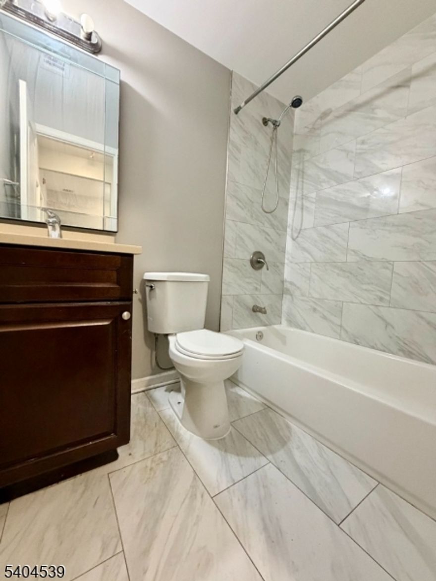 Introducing this beautifully renovated 3-bed, 1-bath apartment in the heart of Newark?s vibrant Clinton Hill neighborhood! Step inside to discover hardwood floors throughout, a bright and open living space, and generously sized bedrooms with plenty of natural light. This home offers a modern eat-in kitchen that features stainless steel appliances, stylish cabinetry, perfect for everyday living and entertaining. Comfort is guaranteed year-round with central heating and cooling! Commuter friendly location! #70 NJ Transit bus arrives at Newark Penn Station (approximately 25?40 minutes travel time depending on time of day) offering quick access to regional rail, PATH, Amtrak, and bus connections for work or weekend travel. Major highways are close by too; I-78 and the Garden State Parkway, making travel throughout northern New Jersey and New York City easy. AVAILABLE FOR AN IMMEDIATE LEASE UP!