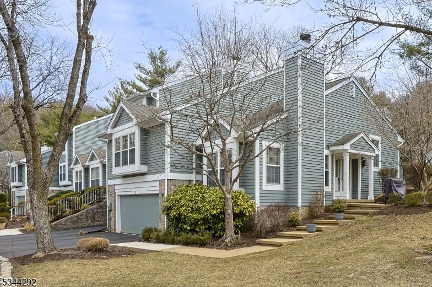 Nestled in the sought-after Hills section of Bedminster, this stunning end-unit condo in the desirable Knollcrest community offers 3 levels of spacious living, featuring 3BED/2.5 BATH. Upon entry, you're welcomed into a sunlit LR with soaring ceilings, elegant architectural details, and intricate moldings. Beautiful HW floors, a WB fireplace, and a charming window bench create a warm and inviting atmosphere.  Level 2 boasts a stylish DR overlooking the LR, setting the stage for intimate gatherings. The pristine white kitchen is a chef's dream, featuring granite countertops, subway tile backsplash, and SS appliances. Adjacent to the kitchen, the FR offers a cozy retreat with a dry bar and sliding doors leading to a private outdoor deck. The primary suite, also located on this level, is a serene sanctuary complete with a custom walk-in closet and a window seat. The spa-like ensuite BATH showcases a double vanity, custom glass-enclosed tile shower, and gleaming hardwood floors.  Level 3 features 2 bedrooms and a full bathroom. The finished lower level offers a spacious recreation area. Additionally, this home includes a 2 car garage and dedicated parking spaces.  Enjoy exceptional amenities, including a trails, gym, tennis courts, clubhouse, a private pool, and 3 additional associations pools.  Conveniently located near The Hills shopping complex with Starbucks, Kings, banks, and local eateries and easy access to major HWY (I-287, 202/206, I-78), parks, golf courses, and more.