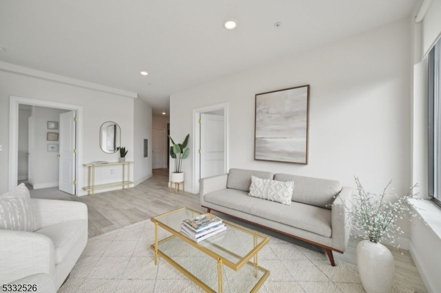 Welcome to The Modern, a luxury high-rise apartment building in East Orange,NJ. This beautiful 2-bedroom, 2-bath home features a spacious kitchen with ample cabinetry, sleek stainless steel appliances, and elegant granite countertops. The primary bedroom offers comfort and tranquility with an ensuite bathroom, while the second bedroom provides generous space. Enjoy the spacious open layout perfect for hosting and entertaining. Sunlight pours through large windows, highlighting the modern design and creating a serene urban retreat. With in-unit laundry and thoughtfully designed interiors, this apartment elevates city living, combining style and convenience in the heart of East Orange's vibrant community. The Modern boasts five floors and 119 residential units, offering a variety of layouts from studios to one- and two-bedroom apartments,all featuring modern finishes, stainless steel appliances, in-unit washer/ dryers, and large windows with great views. Residents enjoy premium amenities, including a fitness center, and community room. The building's prime location offers easy access to major highways and public transportation,making commutes to New York City and other nearby destinations seamless. The surrounding neighborhood provides a wealth of dining, shopping, and entertainment options, along with parks and greenspaces for outdoor relaxation. PARKING AVAILABLE AT ADDITIONAL COST - PHOTOS ARE OF SIMILAR UNIT