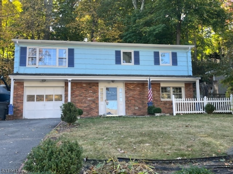 Available for immediate occupancy - opportunity to move into this popular neighborhood - Close to everything - Easy access to highways, Hopatcong Lake & Parks. Optional lake membership available.  Just refinished  hardwood floors on main level - Bright living room & dining room with sliding door to deck & open buffet bar from kitchen.  Nice bedroom sizes. Spacious lower level Family room with half bath. Laundry room & access to garage on this lower level. Low maintenance yard. Plenty of parking in garage & driveway. Tenant responsible for all utilities, First $100 per repair per occurrence & obtain renters insurance. Tenant application with NTN report & income verification required. Pets will be considered for additional rent.