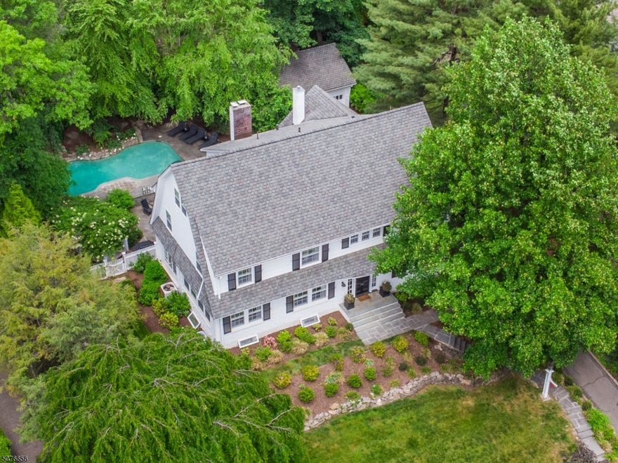 Top-of-the-line chef's kitchen with custom cabinets, marble countertops, eating area, gas fireplace & radiant heat. Spacious rooms with gleaming hardwood floors & custom built-ins throughout. Spacious rooms with triple dentil crown molding. Solarium and kitchen with french doors to outside tiered patio with gazebo, perennial gardens and private, resort-like pool with waterfall complete this beautiful and serene retreat. Laundry on both 2nd floor and in basement. 3 full baths on 2nd floor and one full bath on 3rd floor. Central air, 2 car garage.