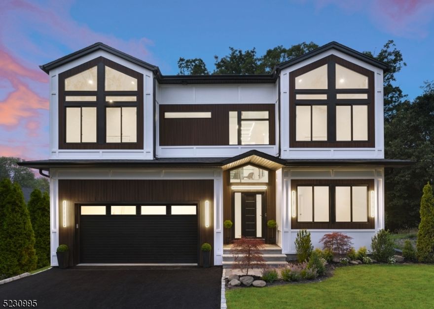 Contemporary masterpiece featuring 3220sf of living space plus 1500sf in basement and exquisitely designed with 6bed, 5,5bath. This smart home offers tranquility and an all-inclusive open floor plan upon a serene grand entrance leading you to soaring 30ft high vaulted ceilings with impeccable detailed white oak wood ceiling accents and feature window. The custom chef's kitchen exudes opulence holding Miele appliances and custom Italian panel cabinetry with a tailored built island featuring a blend of white oak and quartz. Additional features of the first level includes a guest en suite, wine cellar, adjacent to a formal dining area with cove lighting accentuated by white oak wood feature in ceiling . The 2nd level features 4 generous sized bedrooms, 3 full bathrooms, full laundry room, tremendous closet space and access to storage attic. All bedrooms feature soaring vaulted ceilings and custom en suite bathroom with varying designs. The primary suite features white oak paneled wall, vaulted ceiling with sky lights , custom built walk-in closet and an exquisite en suite bathroom with double-head walk-in rain showers, free-standing soaking tub and matte black fixtures.The lower entertainment level offers 1 bedroom, full bathroom and entertainment/ family room, gym/ office/ storage area. 5 Fernwood is an oasis giving the home the utmost seclusion.